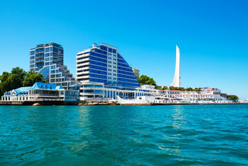 Sevastopol, Crimea, Russia - June 11, 2021: Residential complex Cape Khrustalny and the obelisk to...