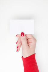 Woman holding blank white business card. Mockup with empty space for text. 
