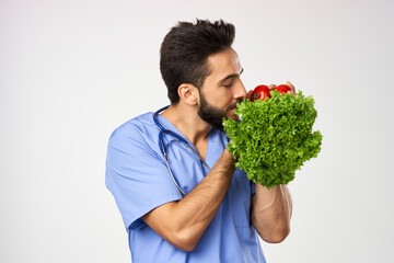 male doctor nutritionist with vegetables in hands healthy food