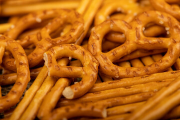 Crispy bread straws with salt, close-up, selective focus, top view.