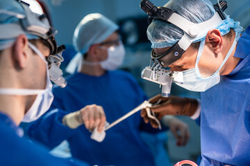 Surgery operation. Surgeon in operating room with robotic surgery equipment. Medical background,...