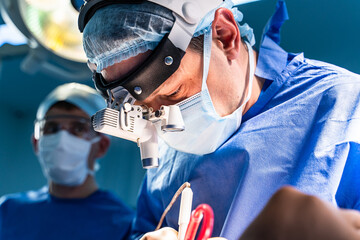 Doctor performs minimally-invasive surgeon using a special device. Minimal invasive surgical...