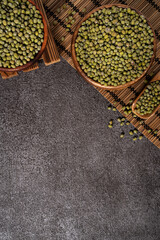 Raw mung bean on wooden table background.