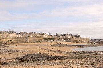 View of the walled city of Saint-Malo from Grand Bé at low tide, France