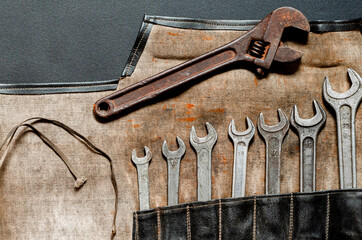 Vintage old tools on stone backdrop. Top view with copy space