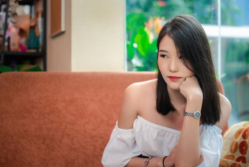 Obraz premium Portrait of young Asian beautiful cute girl in cafe, lifestyle concept