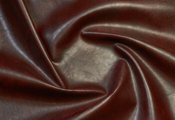 brown artificial leather with waves and folds on PVC base