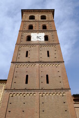 Obraz premium Bell tower. Romanesque bell tower in red brick.Ancient medieval bell tower with windows, arches and clock. 
