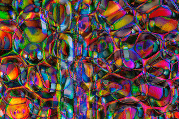 Blistered metal surface illuminated with colorized lights