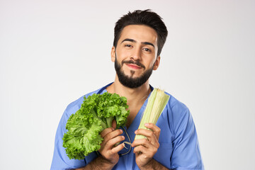 Cheerful dietitian doctor with vegetables in hands stethoscope treatment