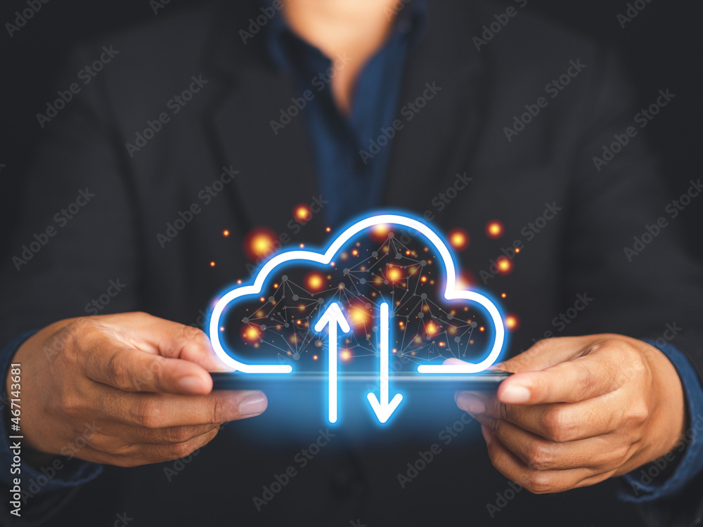 Poster a smartphone connecting to a cloud computing system. businessman in a suit holding a mobile phone lo