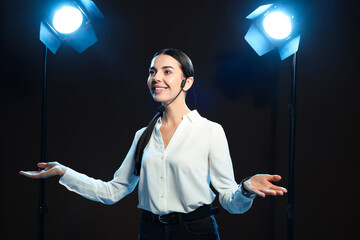 Motivational speaker with headset performing on stage