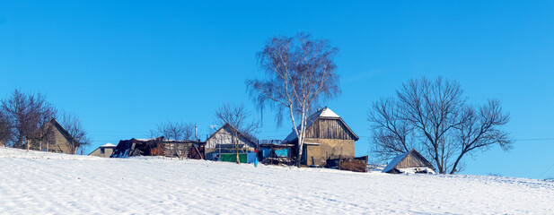 Old village houses in winter on a sunny day