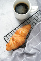 Croissant with a cup of coffee