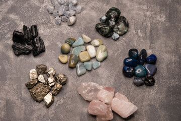 Texture of different types of stones. Gemstones. Different shapes sea rock pebbles. Colorful rocks. Semi precious gem stones collection. Close up of different kinds of stones in a variety of colours.