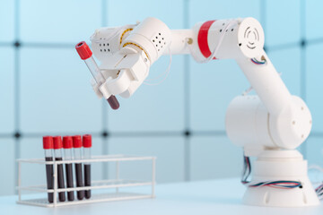 Robot arm with test tube for biological experiments in laboratory