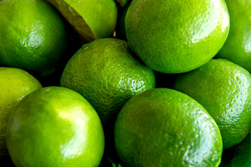 Green lemons texture background.