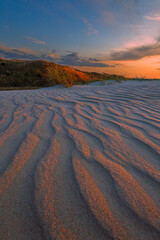 Wavy and narrow patterns in the sand before dawn