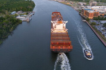 A large container ship leaves the port of Savannah after offloading its cargo