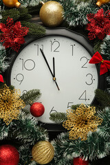 Christmas clock with winter decoration on snow. Happy new year concept.