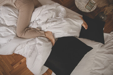 Legs of young woman female girl sleeping in bed