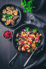 Baked small eggplants, stuffed with mushrooms and pomegranate