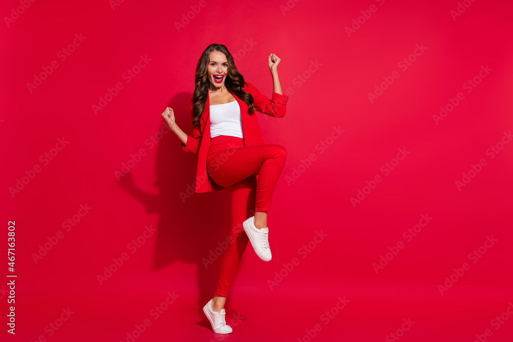 Poster Full body photo of cool impressed brunette lady wear suit sneakers isolated on red color background