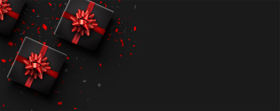Square black gift box with red bow.