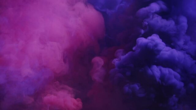 An HD footage of a dramatic smokey background, pink and purple colored
