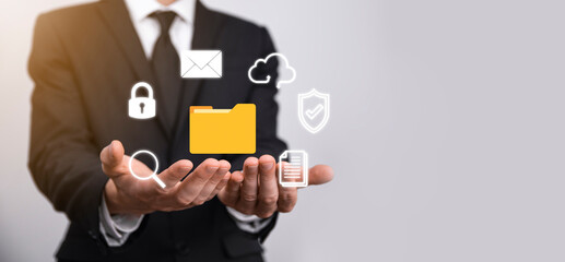 Document Management System DMS .Businessman hold folder and document icon.Software for archiving,...