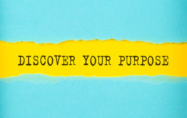 DISCOVER YOUR PURPOSE text on the torn paper , yellow background