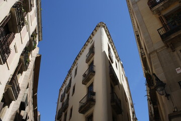 Fototapeta na wymiar old gothic buildings on the streets of barcelona city in a summer day