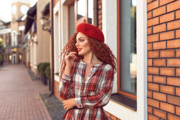 Redhead curly woman in the city