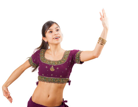 Beautiful indian young brunette dancing