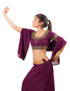 Beautiful indian young brunette dancing