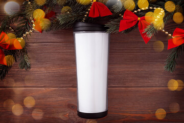 Christmas white tumbler mockup with Christmas decorations and bokeh on wooden background, mockup, flat lay, copy space