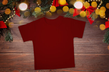 Christmas red t-shirt mockup with Christmas decorations and bokeh on wooden background, mockup, flat lay, copy space