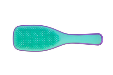 plastic comb of green and purple color, massage brush, isolated on a white background