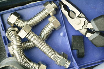 pliers and flexible water hoses