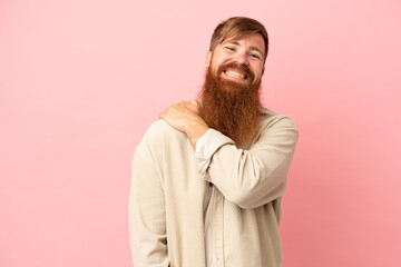 Fototapeta na wymiar Young reddish caucasian man isolated on pink background laughing