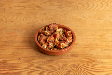 Popular Spanish Tapa of Grilled Marinated Pork Ear in a Clay Pot
