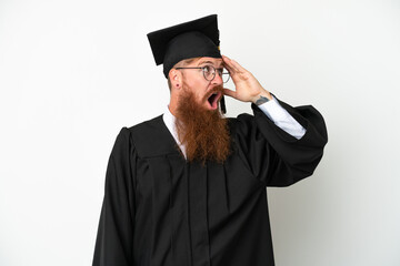 Young university graduate reddish man isolated on white background doing surprise gesture while looking to the side