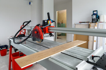 Cutter machine for ceramic tiles. A flat during renovation.