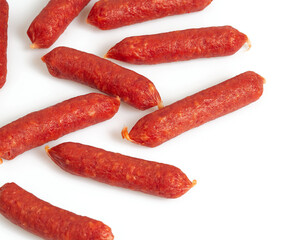 Pile of mini smoked sausages isolated on whit