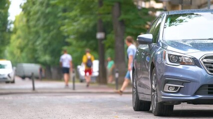 City traffic with cars parked in line on street side