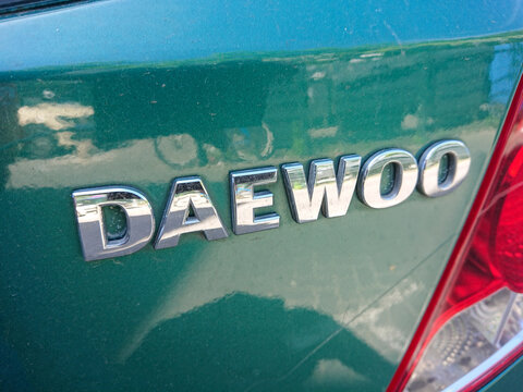 Berlin, Germany - May 12, 2019: Daewoo emblem on a green car. Daewoo also known as the Daewoo Group, was a major South Korean chaebol and car manufacturer
