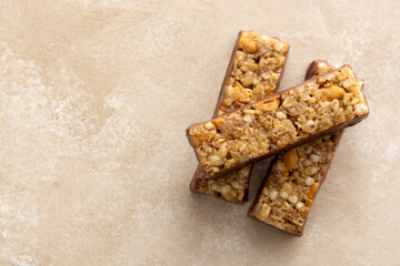 Cereal bars with chocolate and nuts, healthy energy bites. Copy space.
