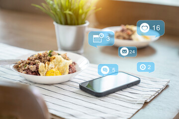 cell phone on the wooden dining table at home