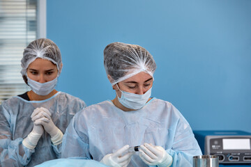 Concentrated Surgical team operating a patient in an operation theater.