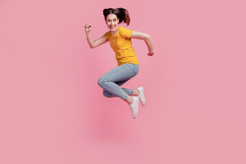 Fototapeta na wymiar Photo of hurry funky crazy brunette woman jump rush side wear casual jeans clothes on pink background